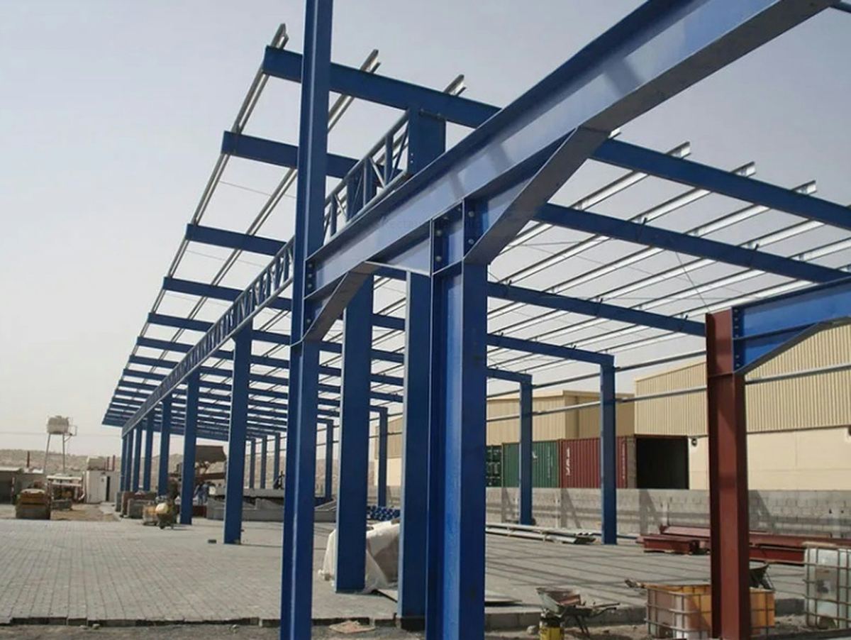 Blue structural steel frame of a commercial building under construction